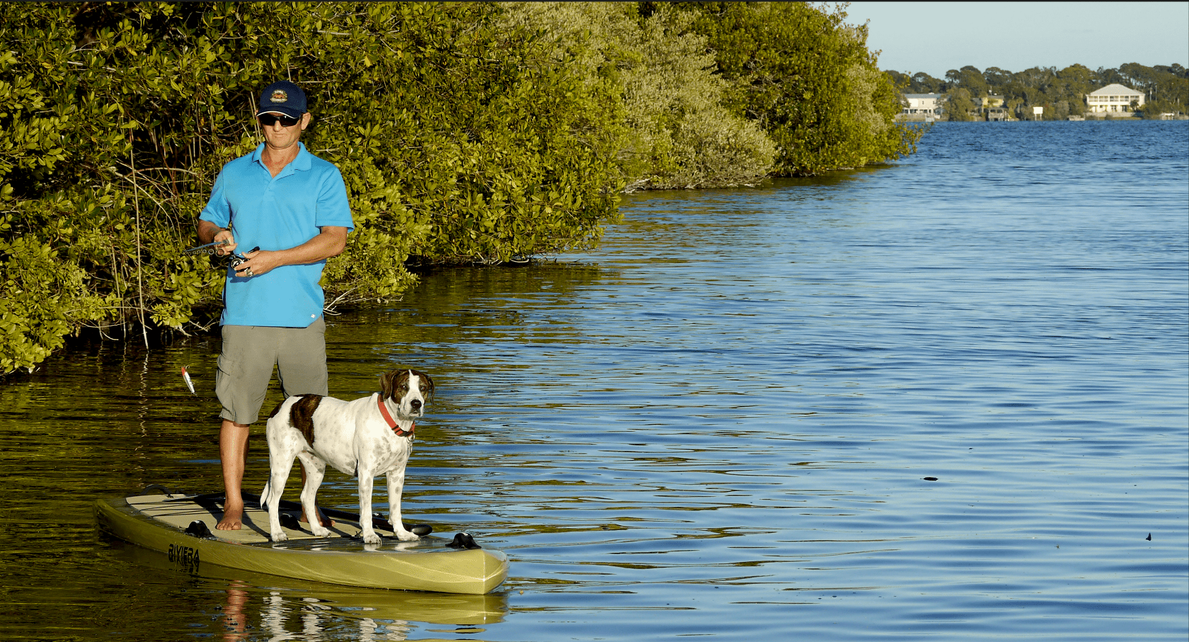 Girard Middleton of SoBe Surf & Paddle on Fishing SUP Board with dog Kona Girard Middleton SoBe Surf & Paddle Fishing SUP Board with dog Kona