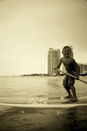 Kids stand up paddle in Miami