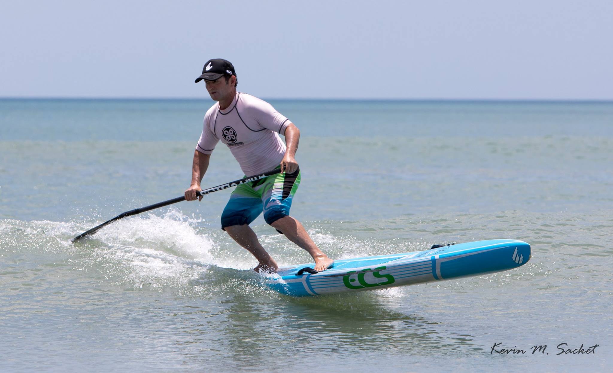 Girard Middleton of SoBe Surf & Paddle surfing a ECS Boards Australia Race Board Girard Middleton of SoBe Surf & Paddle surfing a ECS Boards Australia Race Board