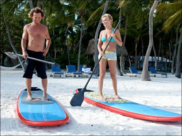 Girard Middleton teaching Bridget how to SUP on the Travel Channel's Bridget's Sexiest Beaches 2008