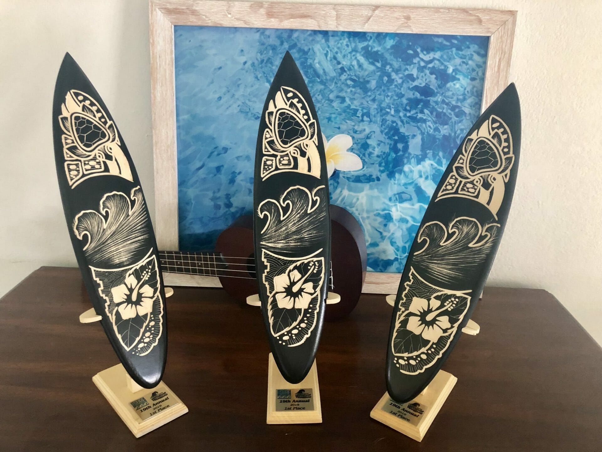 SoBe Surf Owner Girard Middleton’s First Place Surfing Trophies for SUP Short Board, Long board and Race Board Surfing at Waterman’s Challenge June 2019